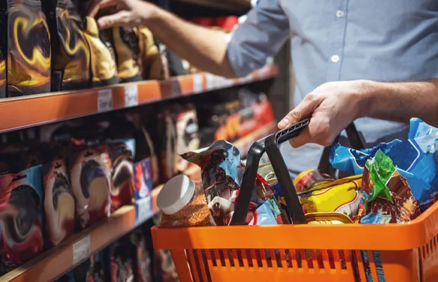 man picking out groceries off the shelf