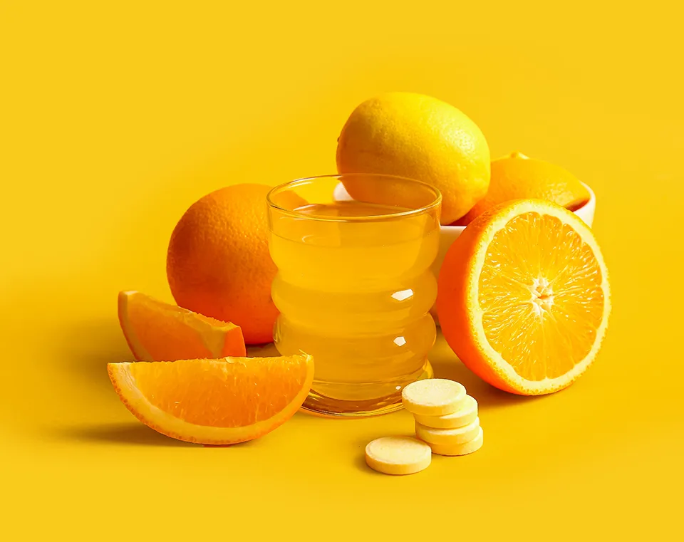 Effervescent Tablets with Oranges on Orange Background