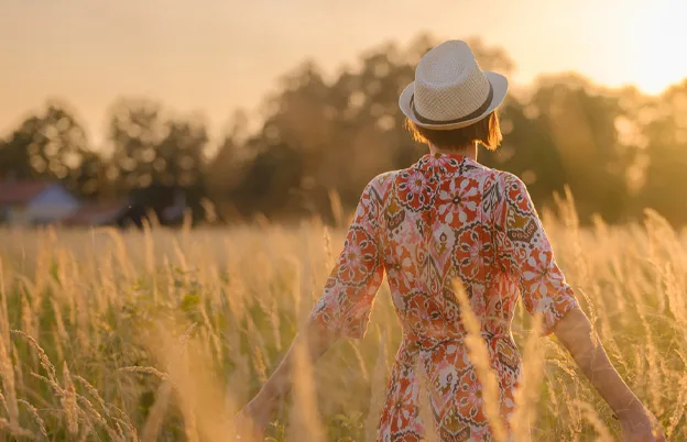 woman standing in a wheat field