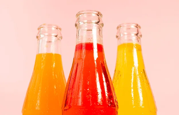 colorful malt beverages in glass bottles