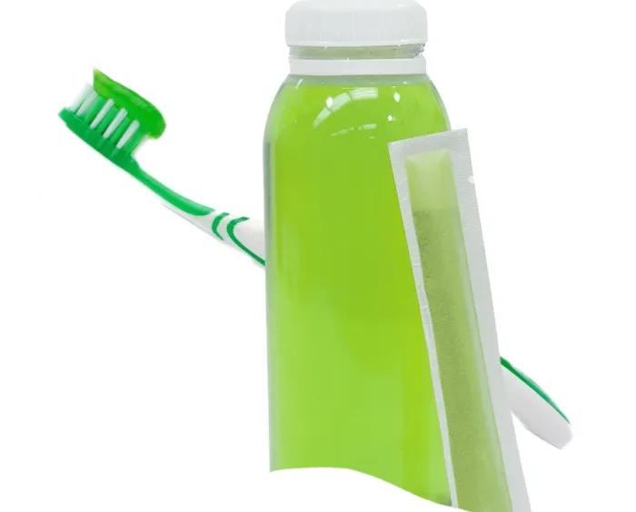 green drink with powder stick and green toothpaste