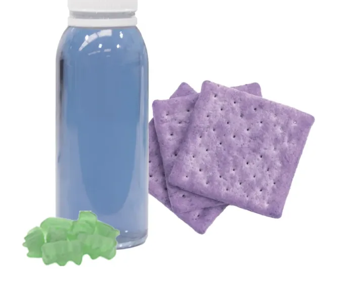 blue drink, green gummy candy, and purple crackers