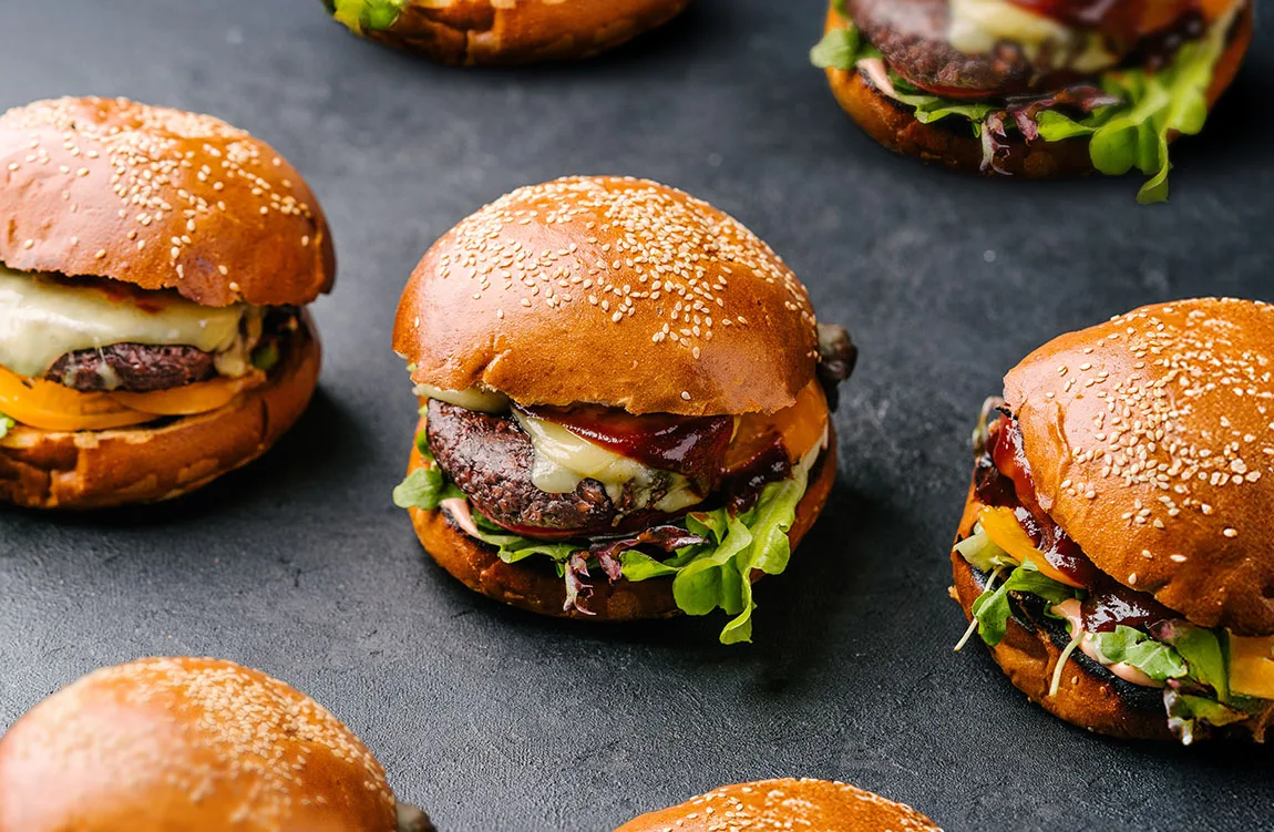 plant based burgers on stone background