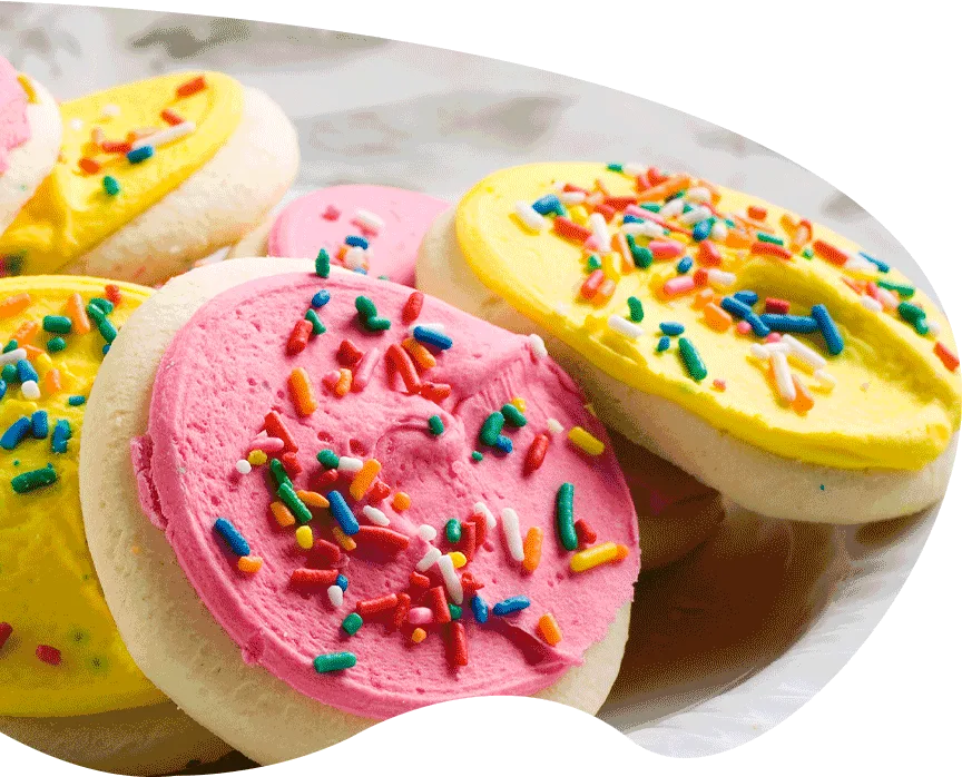 colorful frosted cookies with rainbow sprinkles