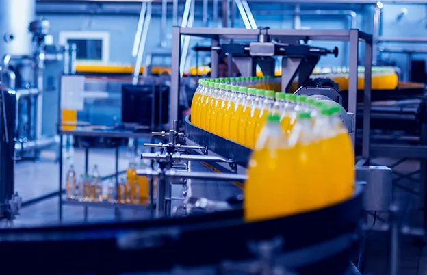 drinks in production on conveyor belt