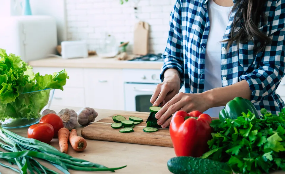 cutting vegetables in kitchen