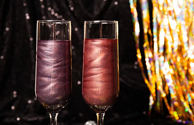 sparkly drinks in champagne glasses