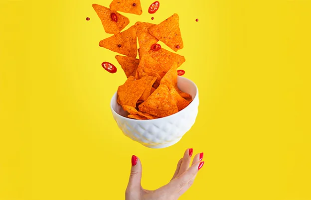 bowl of spicy cheese flavored chips
