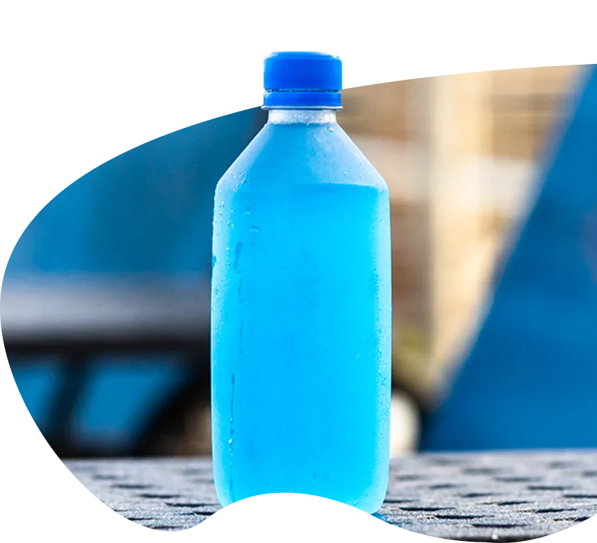 bright blue bottled drink on lounge chair