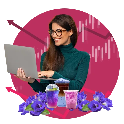 woman looking at laptop with products and graphs