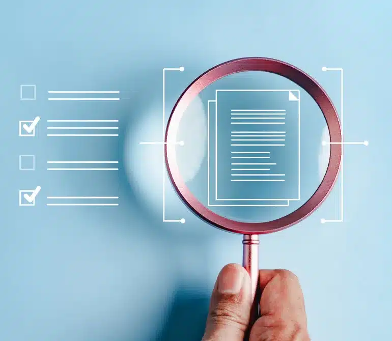 magnifying glass examining a document