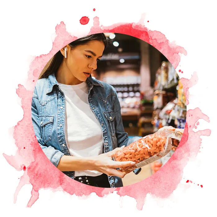 woman looking at red pasta