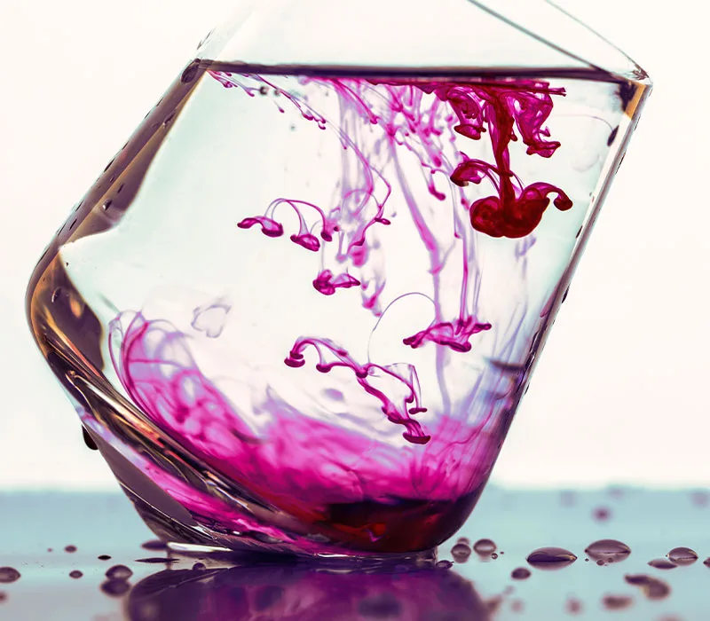 purple liquid dye dispersed in water
