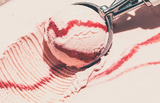 scooping strawberry swirl ice cream