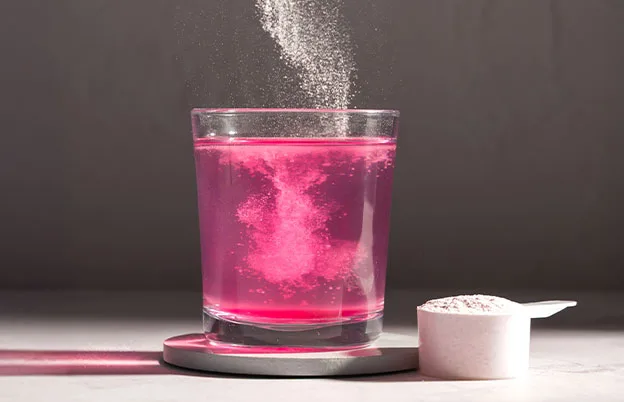 pink powder being dissolved into water