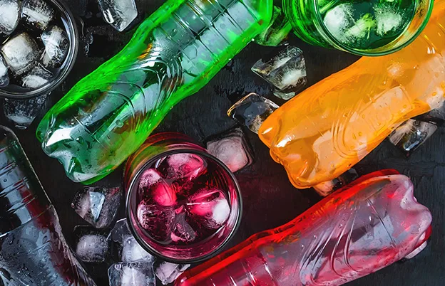 colorful carbonated soft drinks in bottles